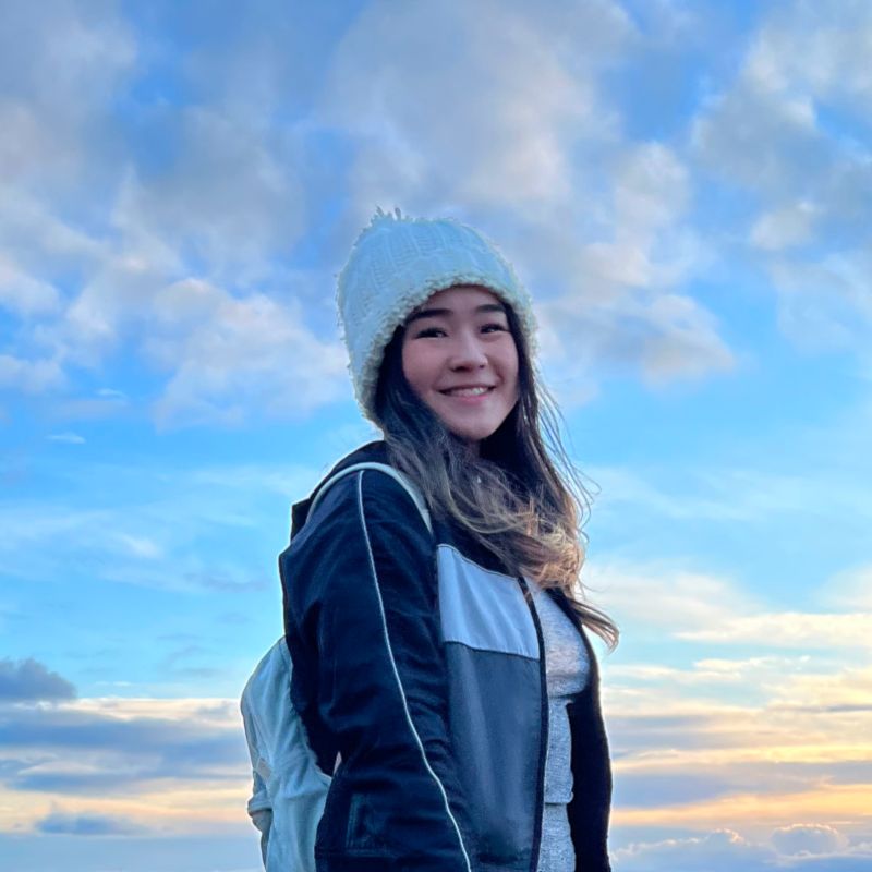 Rebekah Tong standing on a hill in Edinburgh